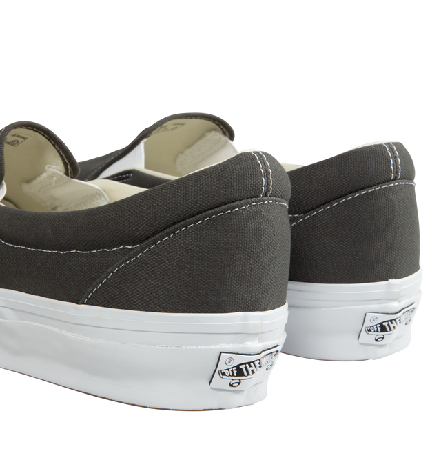 Image 3 of 5 - GREY - Vans slip-on canvas shoes with elastic gores for a flexible fit and logo detailing at quarter, heel, and footbed. Fits true to size. Canvas upper, fabric lining, rubber sole. 