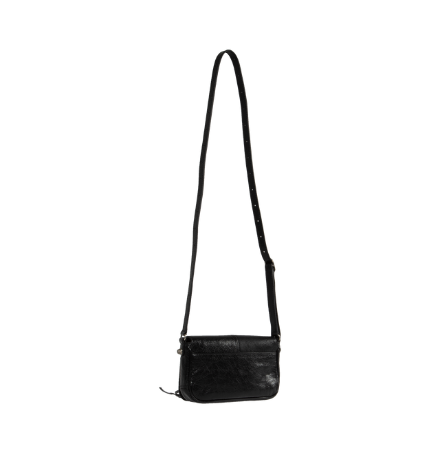 Image 2 of 3 - BLACK - BALENCIAGA Le Cagole Mini Flap Bag featuring arena lambskin, flap bag, adjustable crossbody strap (drop: 19,7 inch), aged-silver hardware, front zipped pocket with knotted leather puller, flap magnet closure, 1 main compartment, 1 inner zipped pocket and 1 back pocket. L7.9 x H5.5 x W2 inch. 100% lambskin. Made in Italy.  