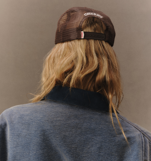 Image 7 of 7 - BROWN - Cherry LA Golden Eagle Trucker Hat is crafted from polyester and features a classic trucker silhouette with a screen-printed Golden Eagle graphic at the front and embroidered detailing at the back. Main Material: Polyester. Fit: Adjustable. Closure: Plastic Snapback Closure. Made in Los Angeles, California. 