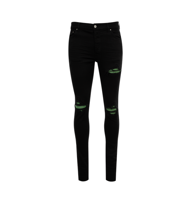 BLACK - AMIRI MX1 Jeans featuring skinny-fit stretch denim, fading, whiskering, and subtle distressing throughout, belt loops, five-pocket styling, button-fly, underlay at front and logo-engraved silver-tone hardware. 92% cotton, 6% elastomultiester, 2% elastane. Made in United States.
