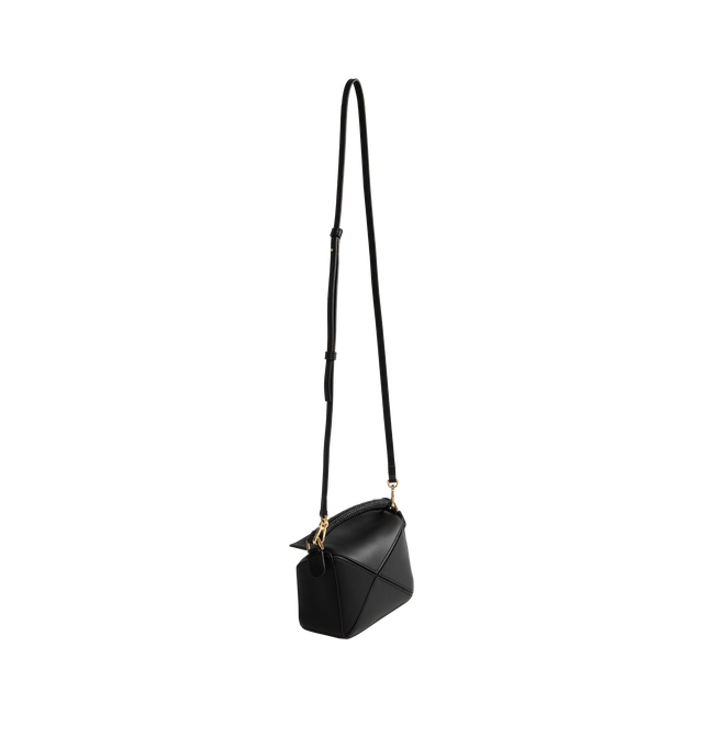 Image 2 of 3 - BLACK - Loewe Mini Puzzle bag in soft grained calfskin featuring a woven nappa lambskin handle.  A cuboid shape and precise cutting technique create Puzzles distinctive geometric lines. Shoulder, crossbody or hand carry with a detachable and adjustable strap, top handle. Featuring zip closure with calfskin pull, herringbone cotton canvas lining, embossed Anagram. Height 4.9" X Width 6.9" X Depth 3". Made in Spain. 