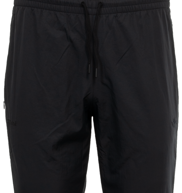 Image 4 of 4 - BLACK - ADIDAS JJJJound Nylon Track Pants featuring regular fit, drawcord on elastic waist, side pockets and ribbed cuffs. 100% recycled nylon plain weave.  