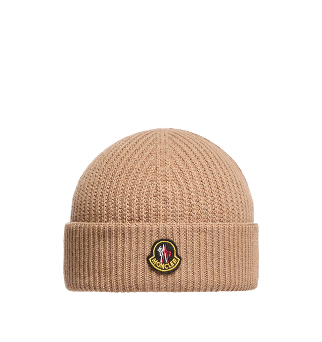 Image 1 of 1 - NEUTRAL - Moncler Men's Wool and Cashmere Beanie is crafted from a luxurious wool and cashmere blend and features a textured half-brioche stitch knit for enhanced softness and dimension. Inspired by Moncler's mountain heritage, this cold-weather accessory is finished with a logo patch reminiscent of vintage alpine pins. Main Material: 90% Virgin Wool, 10% Cashmere. 