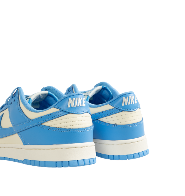 Image 3 of 5 - WHITE - Nike Dunk Low Retro Sneakers are a lace-up style with leather uppers, foam midsoles, padded collars, and rubber outsoles.  