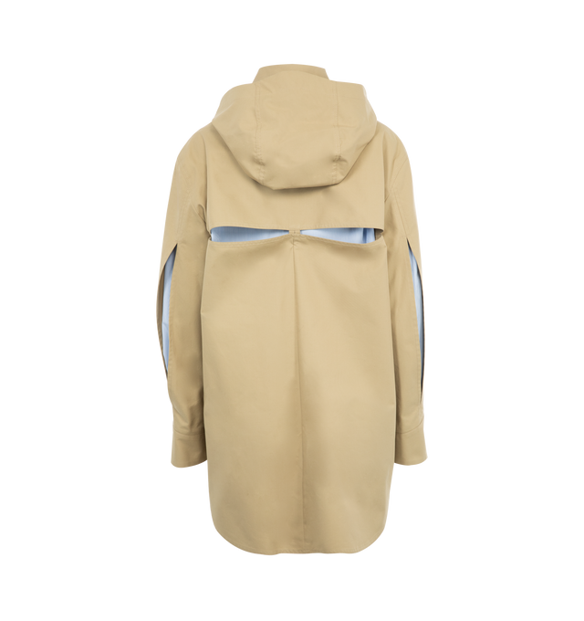 Image 2 of 3 - NEUTRAL - LOEWE Hooded Parka featuring water-repellent medium-weight cotton gabardine, relaxed fit, regular length, cut-out slits at the elbows and at the back revealing striped cotton poplin lining, detachable hooded collar with drawstring, belted cuffs, button front fastening with foldover panel, patch pockets, back pleat, asymmetric front to back hem, side slits with ties and LOEWE Anagram embossed leather patch pocket placed on the chest. 100% cotton. Made in Italy. 