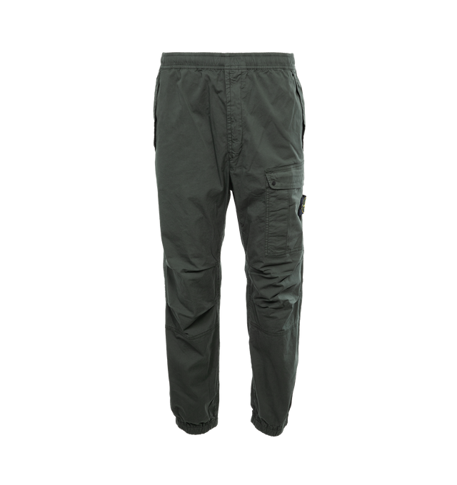 Image 1 of 4 - GREEN - STONE ISLAND Loose-Fit Cargo Pants featuring slanting hand pockets with slanted shaped flap and snap fastening, one patch bellows pocket on the back with shaped flap fixed on one side with a snap on the other side, big patch bellows pocket on the left leg, fixed on one side, snap on the other side, Stone Island badge, elasticized leg bottom and elasticized waistband with inner drawstring. 97% cotton, 3% elastane/spandex. 