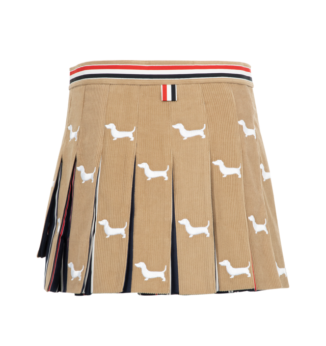 Image 2 of 2 - BROWN - Thom Browne button-front pleated ultra-mini wrap skirt crafted from rich corduroy and adorned with allover Hector embroidery. Featuring front button closure, dropped back hem with signature striped grosgrain trim and signature striped grosgrain loop tab. Fabric 1: 100% Cotton, Combo: 55% Silk, 45% Cotton. Made in Italy. 