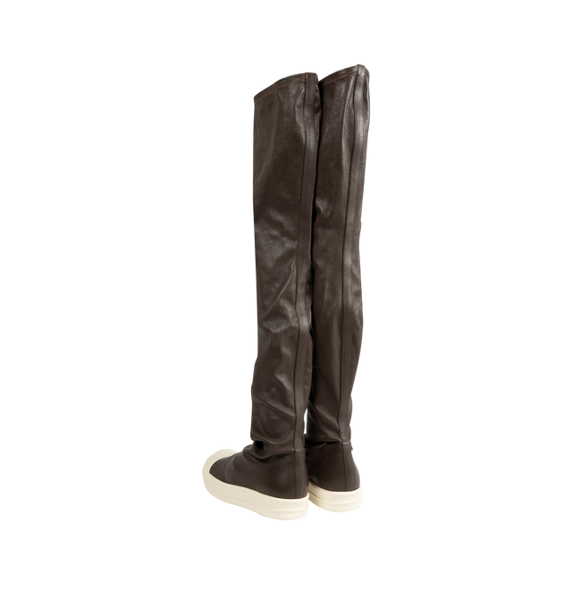 Image 3 of 5 - BROWN - Rick Owens Women's High Stocking Sneakers are crafted from stretch lamb leather and feature an above-the-knee silhouette, draped stocking-style uppers, toe caps, and the brand's signature shark-toothed bumper soles. Designed with a flexible stretch construction created by bonding leather to a cotton and Lycra backing, this statement style combines sculptural proportions with a secure, body-contouring fit. Main Material: 65% Lamb Leather, 34% Cotton, 1% Spandex. Toe: 100% Calf Leather. 