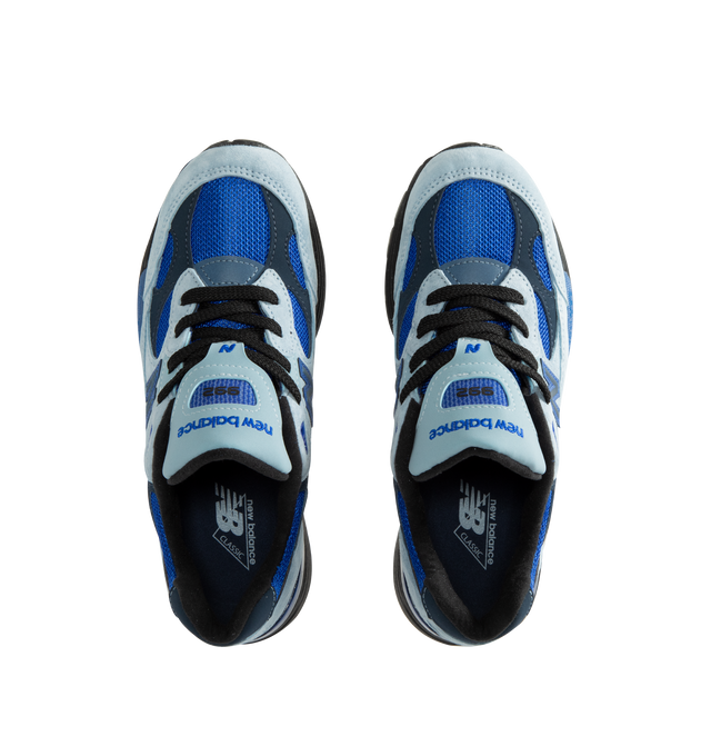 Image 5 of 5 - BLUE - New Balance Unisex Made in USA 992 Sneakers feature a timeless silhouette that blends premium craftsmanship with advanced comfort technology. A fan-favorite since its introduction, this seasonal edition showcases a tonal blue upper crafted from breathable mesh and premium suede overlays, contrasted by a black sole unit. ABZORB cushioning at the heel and forefoot provides exceptional impact absorption, while the ENCAP and C-CAP midsole combination delivers lightweight support and stabil 