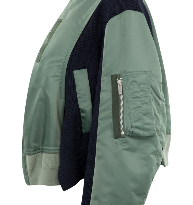 Image 3 of 3 - GREEN - SACAI Paneled Bomber Jacket featuring stand collar, two-way zip fastening through front, panels of cotton-blend shell and ribbed-knit, grosgrain trims along the pockets and an orange lining that flashes brightly when you wear it unzipped. 100% polyester. 100% nylon. 55% cotton, 44% polyester, 1% polyurethane. Lining: 100% polyester. 