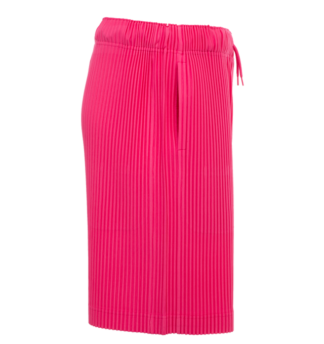 Image 3 of 4 - PINK - ISSEY MIYAKE Pants featuring a relaxed, wide leg, two side pockets, and an elastic drawstring waist. 100% polyester. 