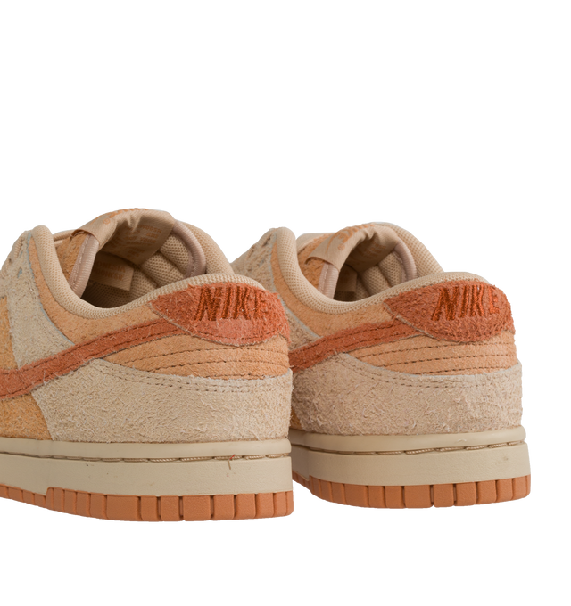 Image 3 of 5 - PINK - Nike Dunk Low Sneakers with "Shimmer and Burnt Sunrise" color-blocking, signature swoosh,  a padded, low-cut collar, leather upper, foam midsole offering lightweight, responsive cushioning. Perforations on the toe add breathability. Rubber sole with classic hoops pivot circle provides durability and traction. 