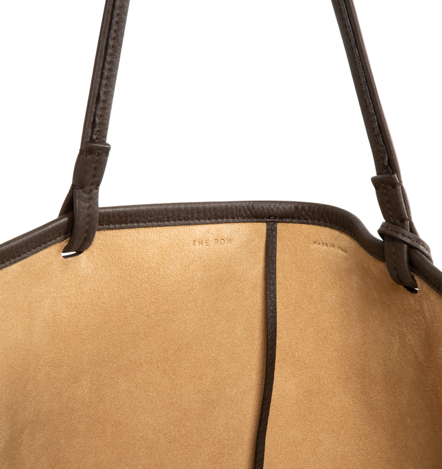 Image 5 of 5 - BROWN - THE ROW XL Park Tote Bag in Leather featuring classic tote bag in textured calfskin leather with interior tie closure, flat handles, and removable interior wristlet with adjustable strap. 100% calfskin leather. Lined in 100% calfskin leather. Made in Italy. 