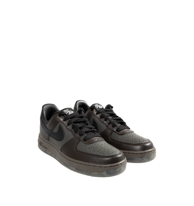 Image 2 of 5 - BLACK - Nike Air Force 1 Low lace-up sneakers in a Black Tea and Petra Brown color combo. Features Nike Air cushioning, low-cut silhouette, padded collar, foam midsole, perforations on toe and rubber outsole. 