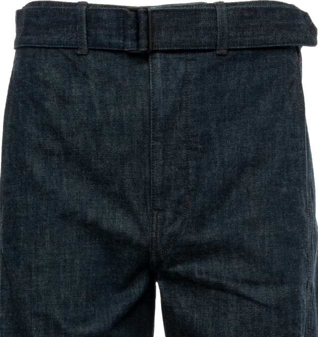 Image 4 of 4 - BLUE - LEMAIRE unisex denim pants in men's sizing. Iconic Twisted Pant crafted of a heavy denim with a visible twill weave and a deep indigo wash. Side-seams are slightly twisted giving the leg a curved shape. Featuring two side pockets, back patch pockets and contrast stitching. The fit is elongated and mid-rise and includes a matching belt to adjust the waist. 100% Cotton. 