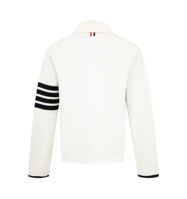 Image 2 of 3 - WHITE - Thom Browne Womens Double-Face Piqu Stitch Polo Collar Jacket is crafted from a virgin wool and cotton blend double-face piqu knit and features a rib-knit polo collar, front button closure, raglan sleeves, rib-knit patch pockets with contrast tipping, rib-knit cuffs and hem, signature 4-bar detailing, internal RWB grosgrain trim, and the signature striped grosgrain loop tab. Main Material: 50% Virgin Wool, 47% Cotton, 3% Polyamide. Made in Italy. 
