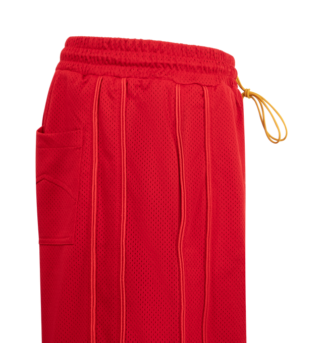 Image 3 of 3 - RED - RHUDE Baggy Collegiate Logo Short featuring poly mesh, logo running across the front legs, side slit pockets, patch pockets on the back, extended drawstrings and tonal piping detail. 100% polyester.100% POLY 