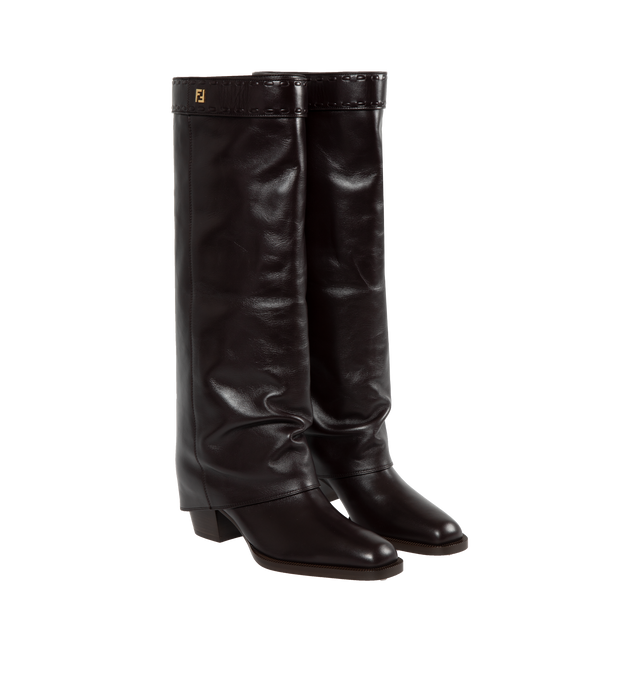 Image 2 of 4 - BROWN - FENDI Show High-Heeled Boots featuring square toe boots with tubular leg, shiny leather, leg partially covers the heel, FF strap at the knee, finished with hand-sewn tone-on-tone macro Selleria topstitches. 55 mm. 100% calf leather. Made in Italy.  