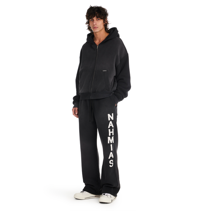 Image 4 of 5 - BLACK - NAHMIAS Applique Baggy Sweatpants featuring baggy fit, elstic waistband, Nahmias drawcord and logo motif applique on leg. 100% cotton.  