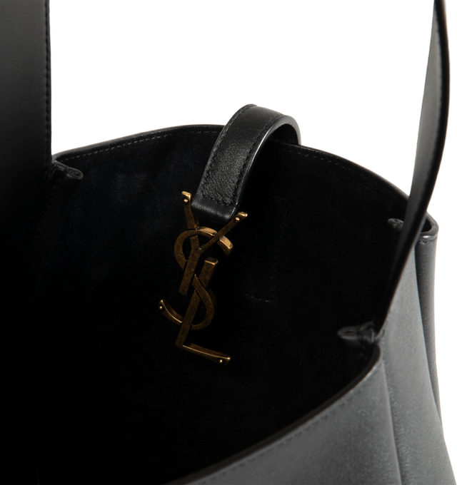 Image 3 of 3 - BLACK - Saint Laurent Womens Le 5  7 Crossbody Bag is crafted from grained calfskin leather. Features an adjustable crossbody strap, CASSANDRE hook closure, removable zip pouch, suede lining, and bronze-tone hardware. Dimensions: 22.5  23  8.5 cm; Strap Drop: 50 cm. Main Material: Calfskin Leather; Lining: Suede; Hardware: Brass. Made in Italy. 