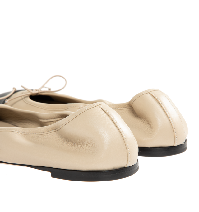 Image 3 of 4 - NEUTRAL - CHRISTEN Tabi Stretch Ballerina Flats featuring grained nappa lambskin, square cleft toe, bow appliqu at vamp, elasticized collar, grained kidskin lining, stacked leather heel with rubber injection and calfskin nubuck sole. Upper: lambskin. Sole: calfskin, rubber. Made in France. 