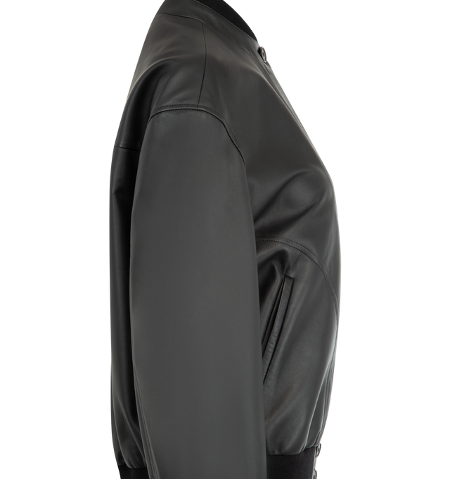 Image 3 of 3 - BLACK - THE ROW Eleonora Jacket featuring supple leather with ribbed-knit trims, a concealed button placket, smooth silk lining, dropped shoulders, loose fit, side seam pockets, button cuffs and elasticated hem. 100% lambskin leather. Lining: 100% silk. Made in Italy. This item may be restricted for online purchase to international clients. For assistance purchasing this item please contact our dedicated stylist team at personalshopping@hirshleifers.com. 