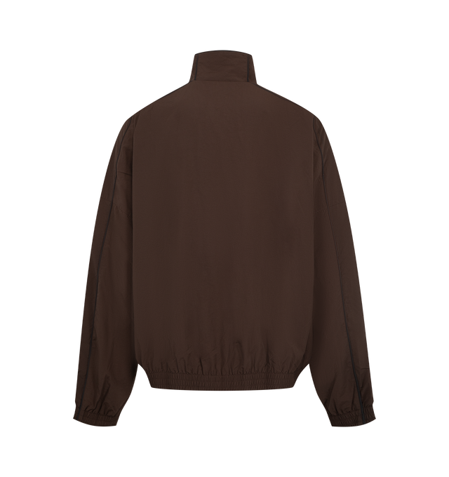 Image 2 of 3 - BROWN - Willy Chavarria Bad Boy Track Jacket is crafted from nylon and features a sleek, true-to-size silhouette defined by bold chevron paneling and contrast piping. Designed with a stand collar, front zip closure, two zippered pockets, stacked script logo detailing, and elasticized cuffs and hem. Main Material: 100% Nylon. Lining: Polyester. 