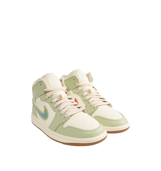 Image 2 of 5 - GREEN - JORDAN Air Jordan 1 Mid SE Sneaker featuring knitted textiles and crocheted charm, leather in the upper, encapsulated Nike Air-Sole unit, rubber in the outsole and mid-cut collar. 