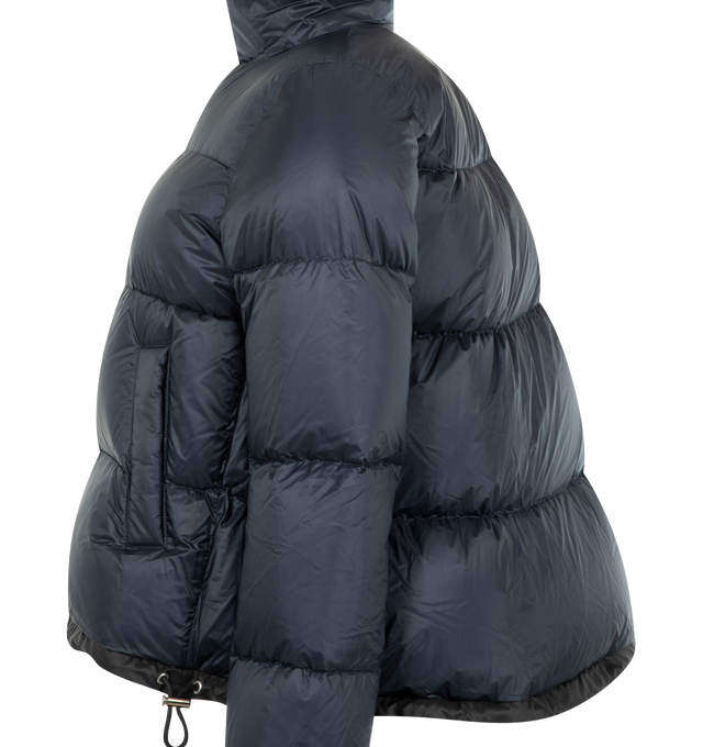 Image 3 of 3 - NAVY - SACAI Short Puffer Jacket featuring quilted nylon, stand collar, zip front closure, welt pockets and drawstring waist and hem. Nylon; polyester combo. Fill, down/feather. 