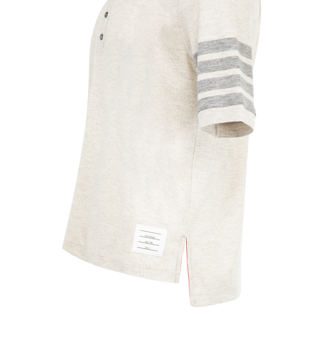 Image 3 of 3 - WHITE - THOM BROWNE Wool Jersey 4-Bar Polo featuring partial front button closure, 4-bar detailing, name tag applique, buttoned side vents with signature striped grosgrain trim and signature striped grosgrain loop tab. 100% virgin wool. Made in Italy. 