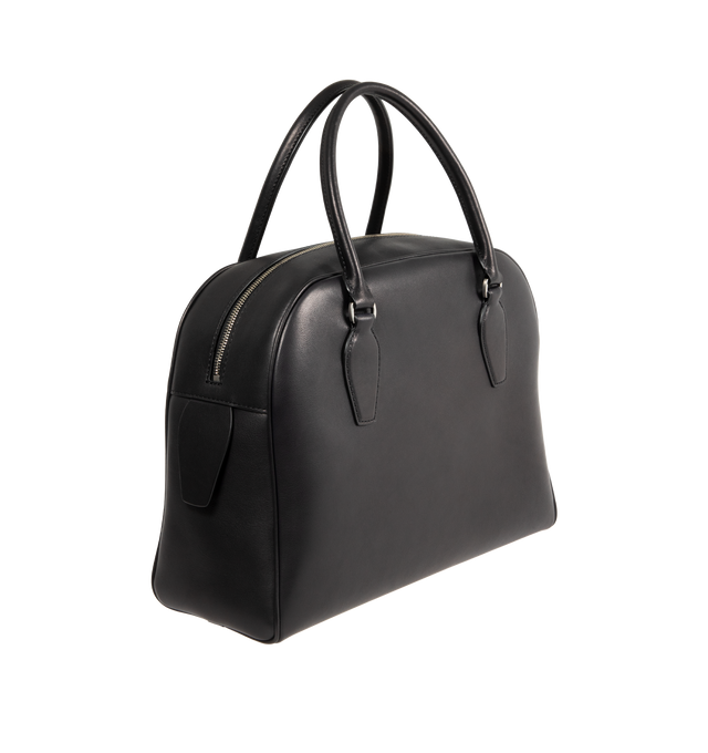 Image 2 of 3 - BLACK - THE ROW India 12.00 Bag in Leather featuring updated bowling bag in polished saddle leather with tubular handles, branded metal padlock and key, and zipper closure. 12 x 9.5 x 12 in. 4.75 in. Handle drop. 100% calfskin leather. Lined in 100% leather. Made in Italy. 