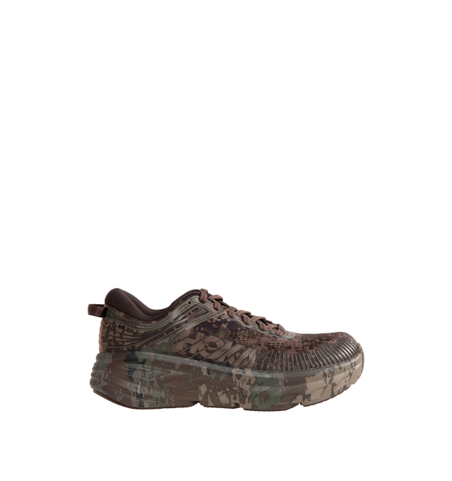 Image 1 of 5 - BROWN - Hoka Unisex Bondi 7 Beams Sneakers reinterpret the ultra-cushioned silhouette with a custom camouflage upper inspired by Japanese Zen gardens. The vegan open-mesh construction features a memory foam collar, TPU overlays, 3D-printed logos, a reflective secondary lace, and a lace keeper. Upper: Vegan Mesh and TPU. *Unisex style in men's sizing. 