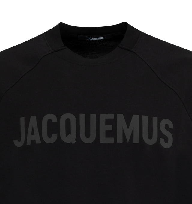 Image 2 of 2 - BLACK - JACQUEMUS Raglan Logo T-Shirt featuring relaxed fit, partially ribbed crew neck, elbow-length raglan sleeves and logo on the chest. 19% cotton, 10% elastane. Made in Portugal. 