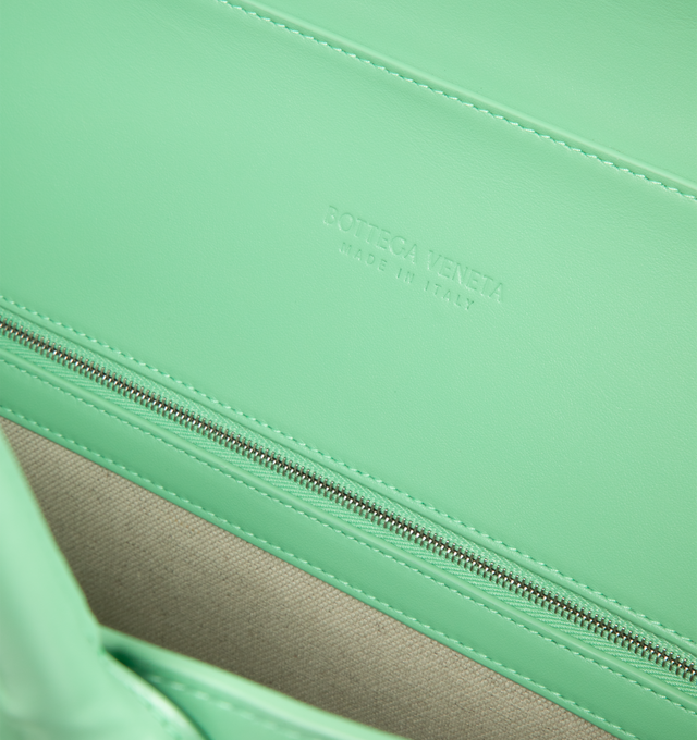 Image 3 of 3 - GREEN - BOTTEGA VENETA Andiamo Voyager featuring suede and smooth leather with signature knot detail, adjustable and detachable cross-body strap, two top handles, one interior zipped pocket, two flat open pockets, one key hook on a strap and magnet closure. Lining: canvas. 15.4" x 16.9" x 7.1". Calfskin. Made in Italy. 