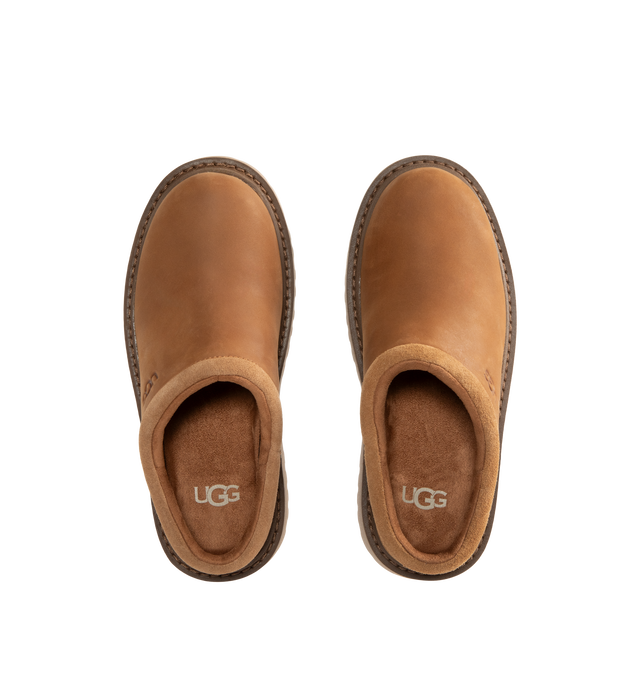 Image 4 of 4 - BROWN - UGG Men's Birch Clog II is crafted from premium suede and features a slip-on clog silhouette with a soft lining and cushioned footbed for exceptional everyday comfort. These designer clogs combine UGG's signature cozy feel with durable construction, making them a versatile choice for both indoor and outdoor wear. Main Material: Suede. Lining: Soft Textile. Sole: Rubber. 