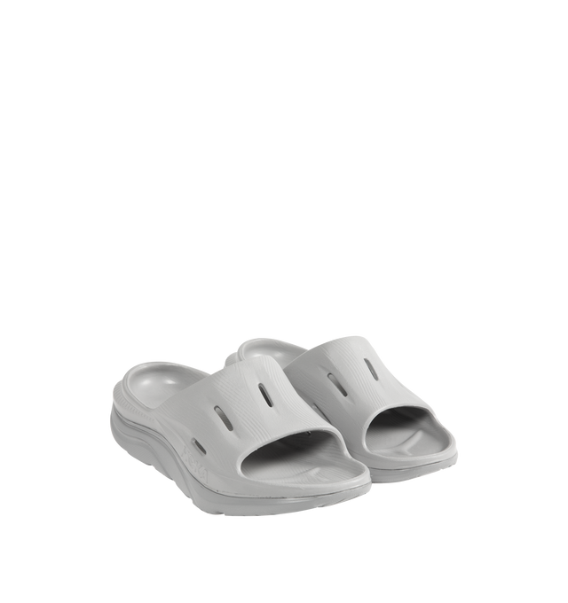 Image 2 of 4 - GREY - HOKA Ora Recovery Slide 3 featuring perforated rubber upper with EVA sole, slip-on styling and molded footbed.  