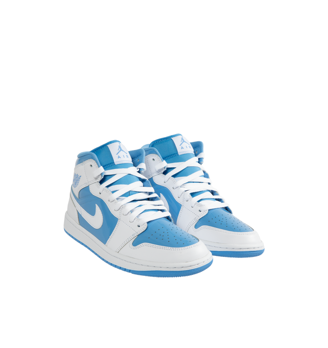 Image 2 of 5 - BLUE - AIR JORDAN 1 MID SE basketball shoe in white and Legend Blue leather upper featuring an angled profile, toe box perforations, mesh tongues and lining, encapsulated Air cushioning underfoot, and distinctive Jordan detailing. Air-Sole cushioning provides lightweight, responsive comfort.  Leather and textile upper/synthetic lining/rubber sole. 