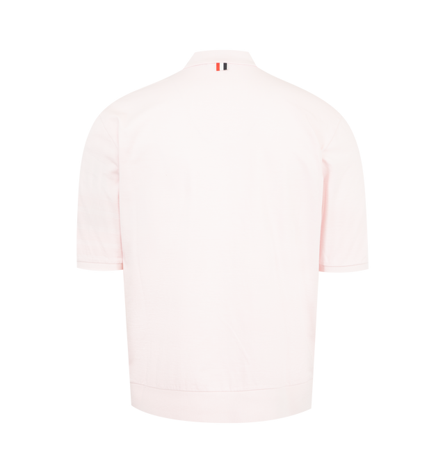 Image 2 of 3 - PINK - THOM BROWNE Garment Overdyed Jersey 4 Bar Polo featuring partial front button closure, ribbed collar, sleeve cuffs, and hem, overdyed 4-bar detailing, name tag appliqu, signature striped grosgrain loop tab and garment dyed. 100% cotton. Made in Italy. 