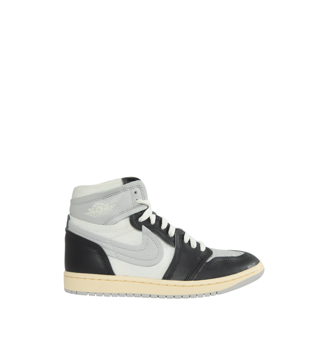 Image 1 of 5 - GREY - AIR JORDAN 1 HIGH METHOD OF MAKE features a real and synthetic leather in upper, encapsulated Nike Air unit, rubber in the outsole, wings logo on collar, embroidered Swoosh logo and Jumpman on tongue. 