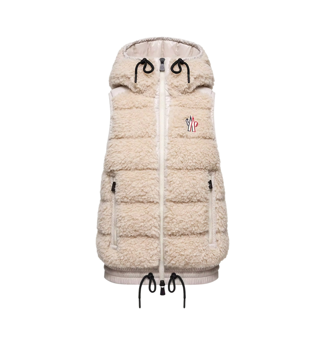 Image 1 of 1 - CREAM - Moncler Women's Teddy Hooded Down Vest is crafted from plush teddy fleece and features a down-filled construction, nylon laqu accents, and an adjustable hood. Designed for skiing, snowboarding, hiking, and trekking, this cold-weather layer is finished with a front zip closure, zipped pockets, an elasticized hem, and a signature logo patch. Main Material: 100% Polyester. Contrast Material: 100% Polyamide/Nylon. Lining: 100% Polyamide/Nylon. Hood Lining: 100% Polyamide/Nylon. Padding: 9 