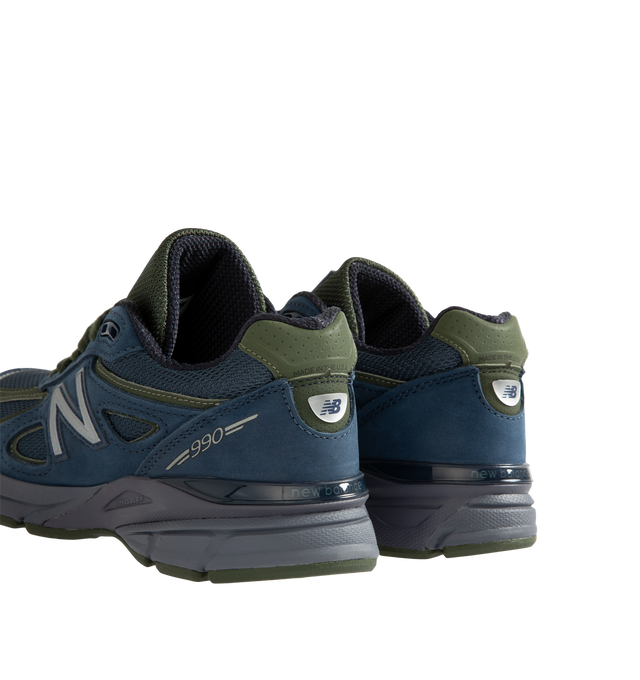 Image 3 of 5 - NAVY - New Balance Unisex Made in USA 990v4 Sneakers feature the iconic silhouette that has defined premium running-inspired footwear since its debut in 1982. Originally introduced in 2016, the 990v4 further refined the modernization of the classic design with a premium combination of mesh, nubuck leather, and synthetic overlays. Finished in a versatile grey and navy color palette, this Made in USA edition is equipped with ENCAP midsole cushioning that combines lightweight foam with a durable 