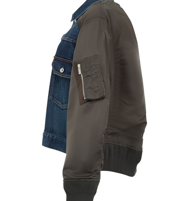 Image 4 of 4 - BLUE - Sacai denim bomber blouson with cotton denim front panel and contrast nylon twill sleeves. Features a classic collar, button-front closure, contrast stitching, patch pockets with flap and button, zip pocket on the sleeve, ribbed hem and cuffs, and back central crease. Outer is 100% cotton denim with 100% nylon sleeves and 100% polyester lining. Made in Japan. 