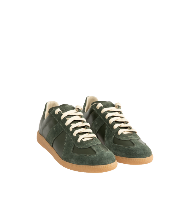Image 2 of 5 - GREEN - Maison Margiela Men's Replica Sneakers featuring lace-up sneakers in buffed nappa calfskin and calfskin suede, contrasting sole, Maison Margiela logo label on the tab, internal Replica label, internal elastic and all-over Maison Margiela logo insole. 100% calf leather. Sole: 100% rubber. Made in Italy. 