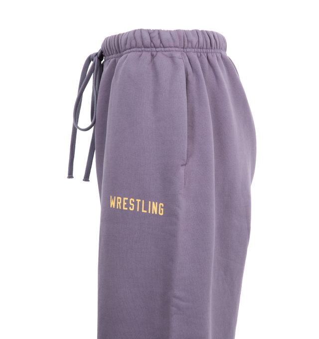 Image 3 of 3 - PURPLE - Fear of God Cotton Fleece Sweatpants (Womens) have an elastic drawstring waist, side seam pockets, elastic hems, and logo details. 83% cotton, 17% recycled polyester fleece.  