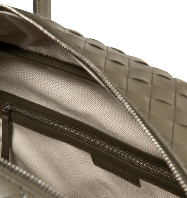 Image 3 of 3 - GREEN - BOTTEGA VENETA Getaway Weekender featuring soft Intrecciato leather with adjustable and detachable strap, signature knot detail, padded laptop compartment, one zipped pocket and zipper closure. Lining: canvas. 13" x 16.9" x 7.5". Handle drop: 6.5". Calfskin. Made in Italy.  