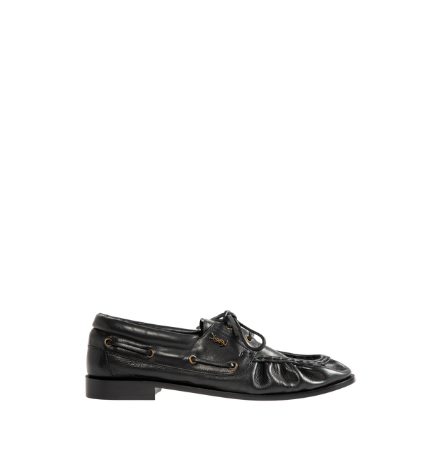 Image 1 of 4 - BLACK - Saint Laurent Mens Boat Shoes are crafted from metal-free tanned calfskin leather. Feature a lace-up boat shoe silhouette, hand-stitched moc toe, gold-tone CASSANDRE hardware, leather sole, and 1.5 cm heel height. Main Material: Calfskin Leather; Hardware: Brass; Sole: Leather. Made in Italy. 