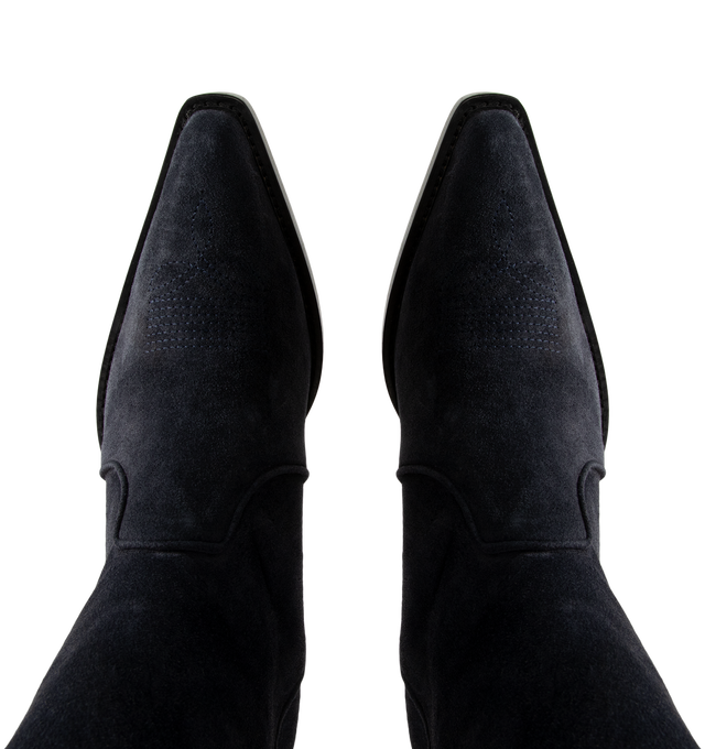 Image 4 of 4 - NAVY - Khaite Women's Clive Ankle Boots are crafted from hand-worked split-suede calfskin in midnight navy. Inspired by Western styles, the ankle-high silhouette features a snipped toe, deliberately tilted shaft, stitched welt, and stacked patinated-leather heel. Upper: 100% Calfskin. Sole: 100% Calfskin. Heel Height: 3.5 cm / 1.4 in. Made in Italy. 