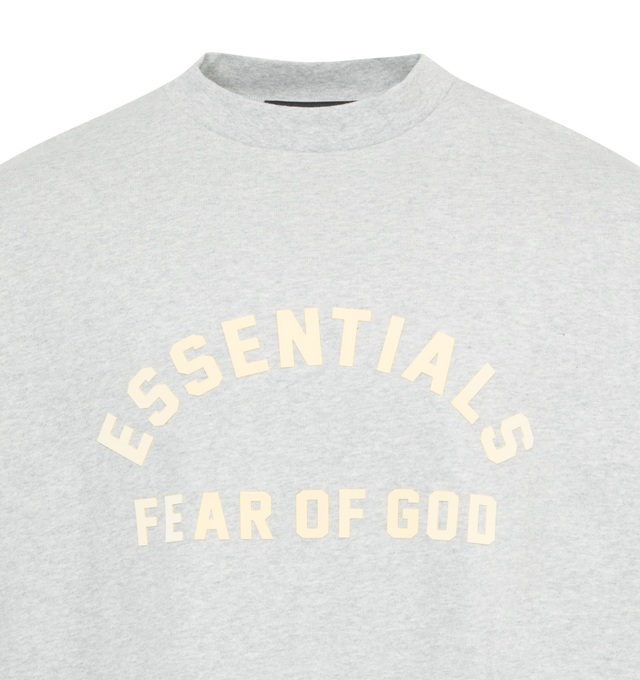 Image 2 of 2 - GREY - FEAR OF GOD ESSENTIALS Crewneck Long Sleeve T-Shirt featuring rib knit crewneck and cuffs, logo bonded at front, dropped shoulders and rubberized logo patch at back. 100% cotton. Made in Viet Nam. 