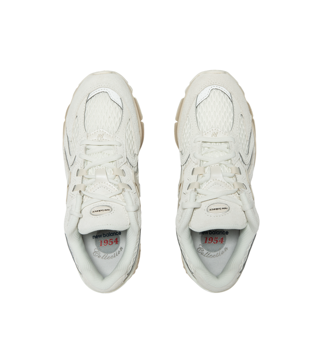 Image 5 of 5 - WHITE - New Balance 1954R Unisex Sneakers feature a suede and mesh upper inspired by the 2002 and 1906 models, combining breathable mesh with synthetic and pig suede overlays. ABZORB midsole cushioning absorbs impact through a combination of cushioning and compression resistance, while a traditional lace-up closure provides an adjustable fit. Upper: Synthetic, Mesh, and Pig Suede.  