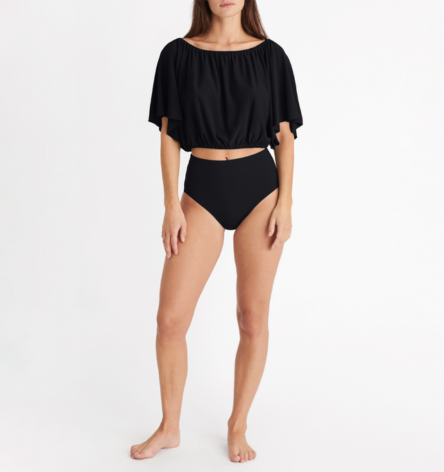 Image 2 of 5 - BLACK - ERES Solal Crop Top featuring elasticated neckline and waist with short butterfly sleeves. 94% Polyamid, 6% Spandex. Made in France. 